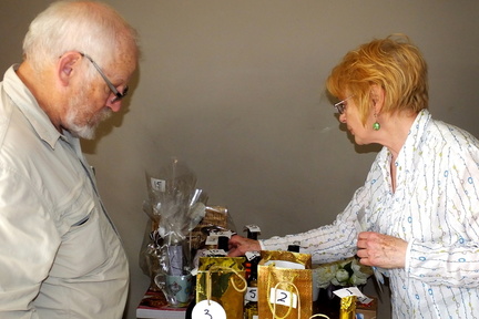 Parry Jones, Kate Simmons checking prizes