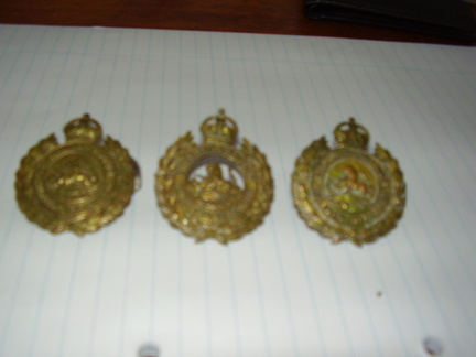 1933 -47 cap badges. 