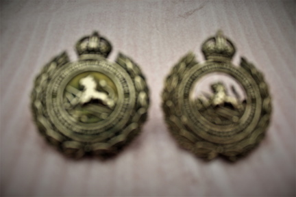 1933 -47 cap badges. 