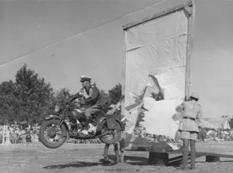 1950 Police Display at Bulawayo 4526 Doug Almy performing a blind ramp jump on an Indian motorcycle
