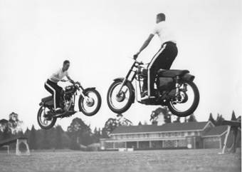 1959 Police Display Terry Franklin and John Osborne performing the diagonal cross-over ramp jump