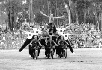 Display mid 50s - eleven men on three motorcycles